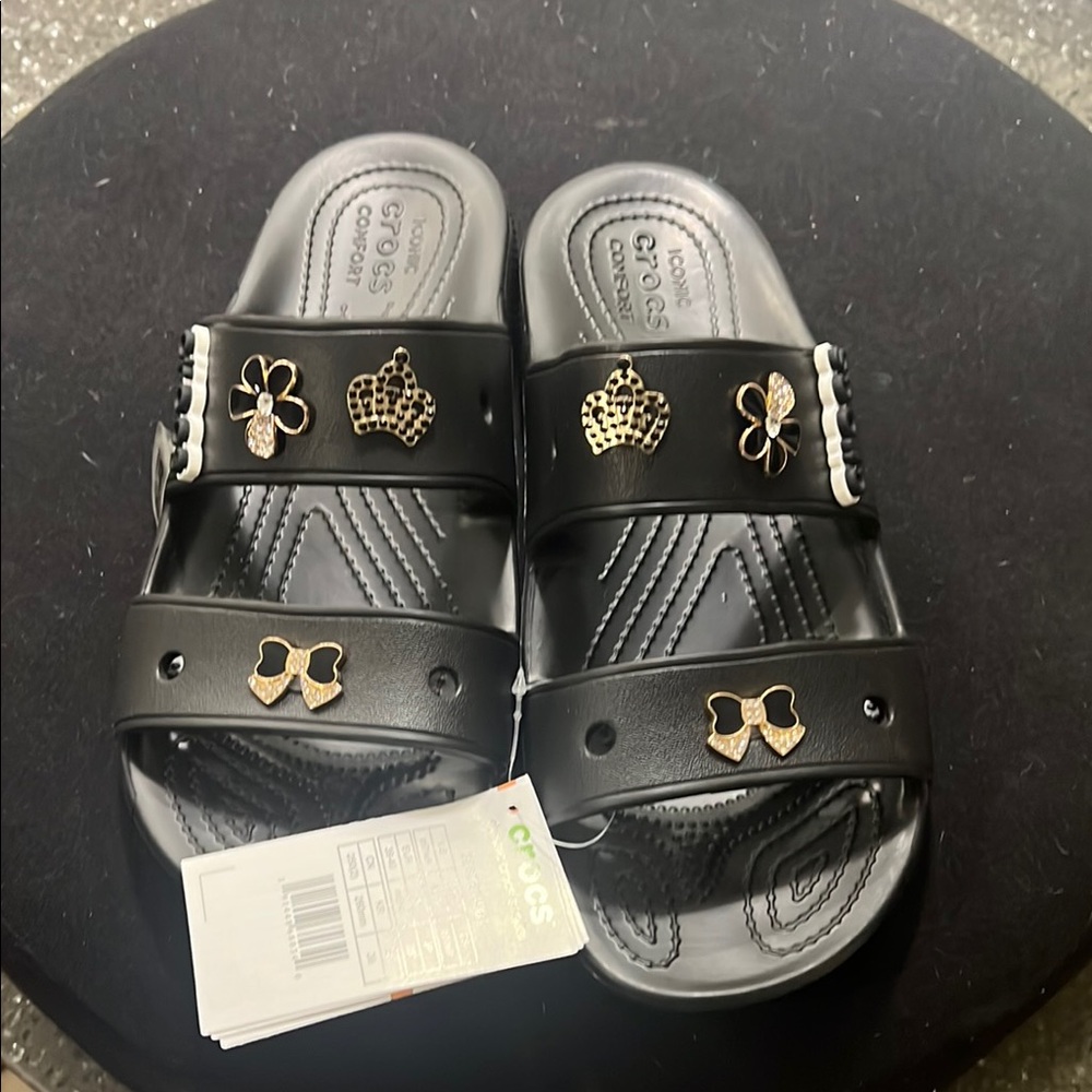 Crocs Kids Black Sandals with Gold Accents